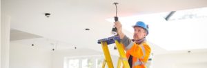 Electrician-Installing-Downlights