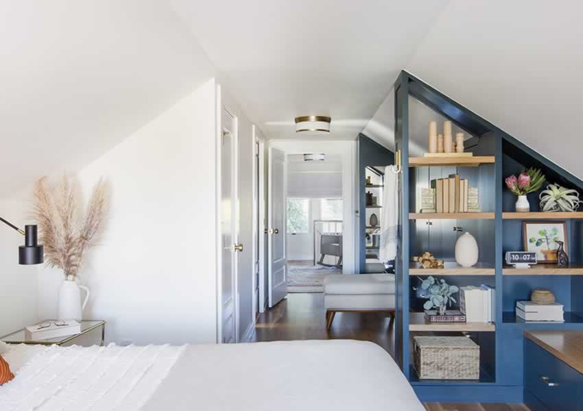 Loft conversion with bespoke carpentry shelving, bedroom, shower room and storage