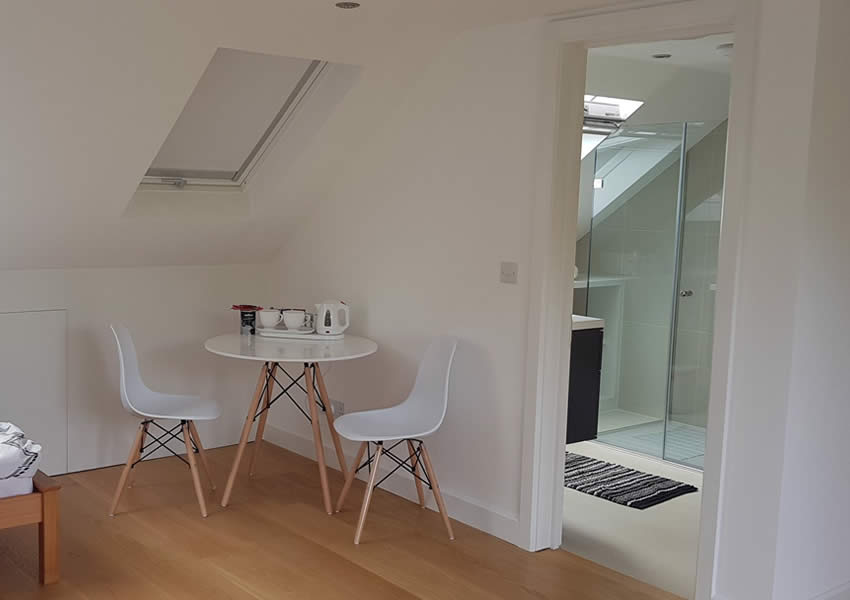 Loft conversion with bedroom and shower room in Putney