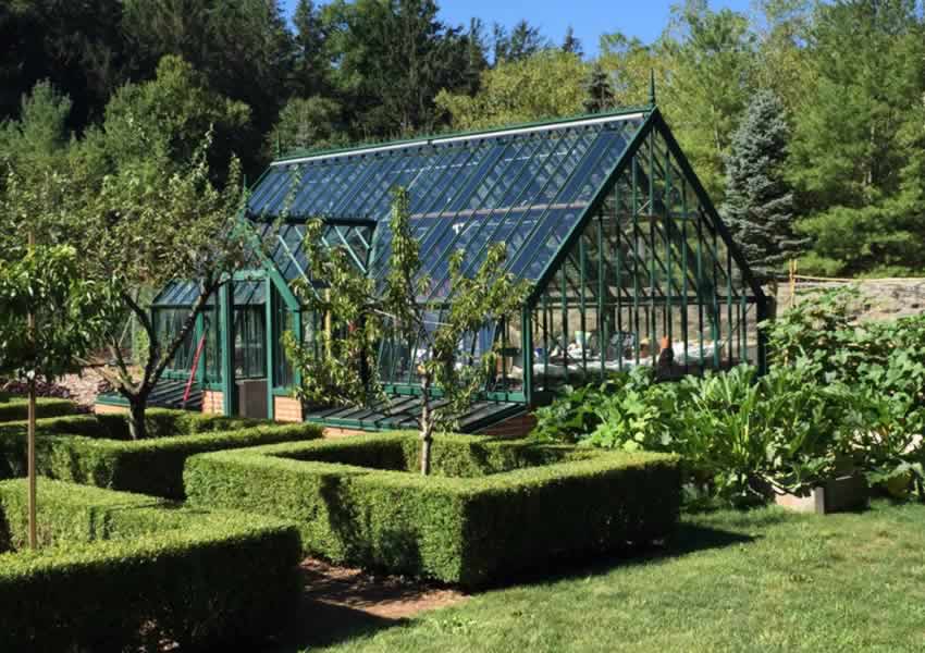 box edged parterre garden with greenhouse